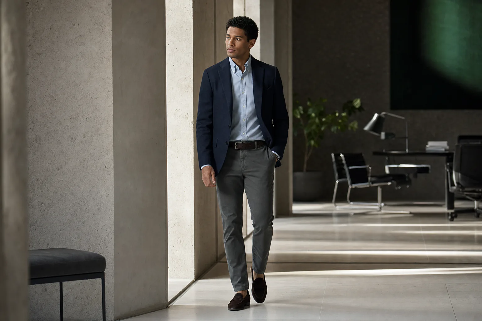 Man in a navy blazer, Oxford shirt, charcoal chinos, and loafers